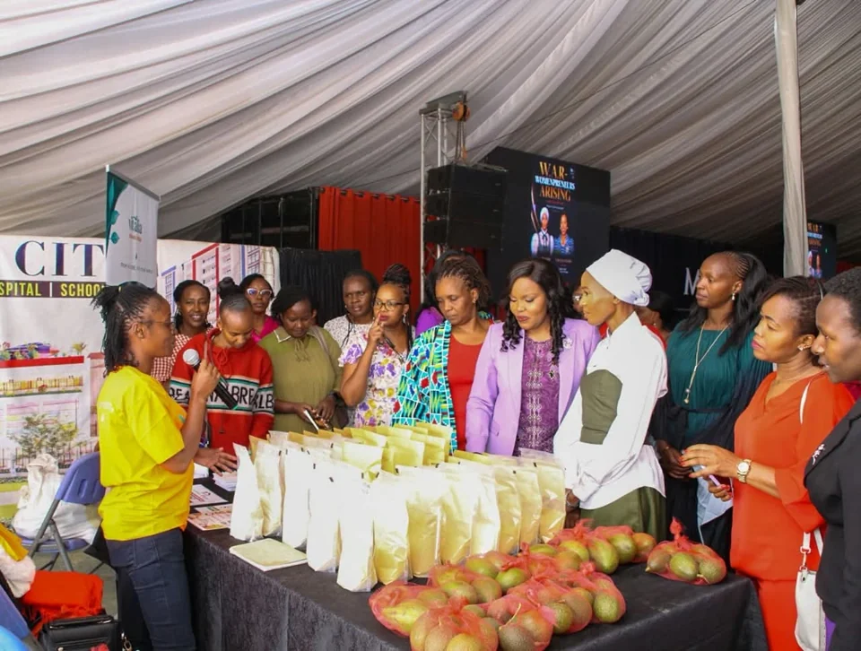 Womenpreneurs Arising exhibition with women exploring business displays